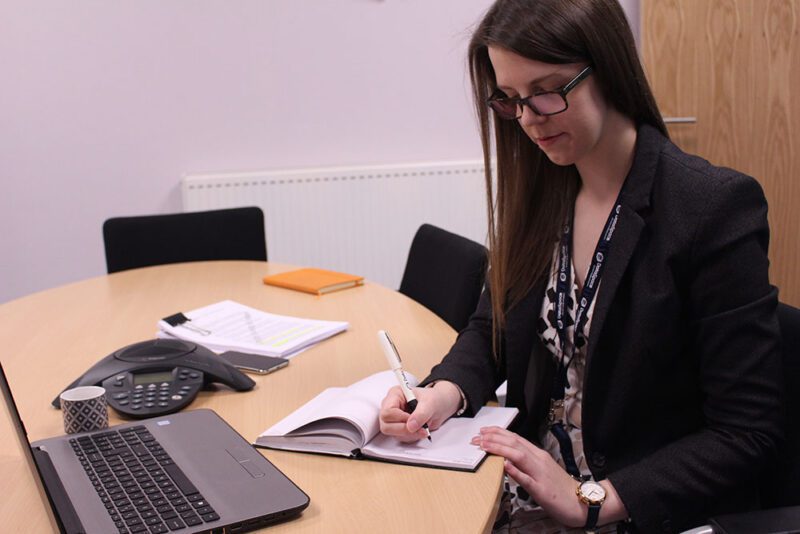 Woman working inside a self storage office